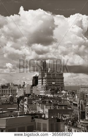 MADRID, SPAIN - MAY 13, 2018: Telefonica Building rise above historical buildings on Gran Via business district.