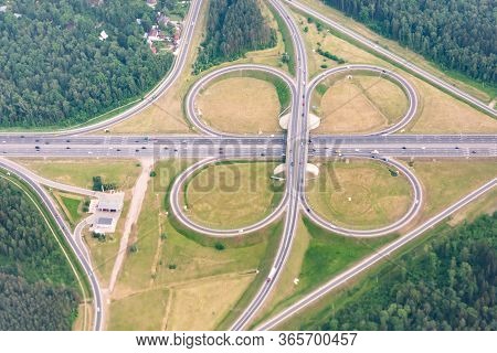 Road Interchanges In The Moscow Region. Cloverleaf Overpass. View From The Plane Window.