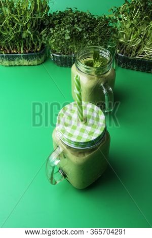 Fresh Organic Healthy Green Smoothie With Spinach, Kiwi, Microgreen Sprouts, Parsley, Celery, Cucumb