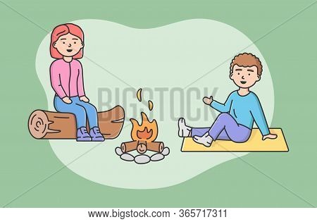 Concept Of Family Spending Time. Happy Mother And Son Sitting On Log At Campfire Together. People Co