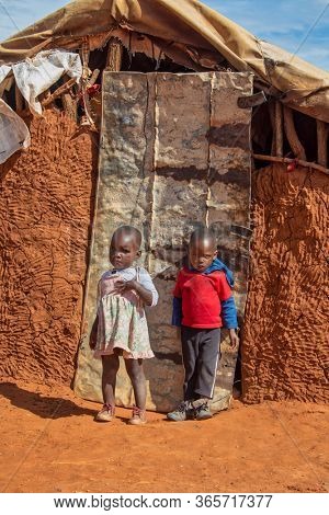 African children in front of the house in a village in Botswana