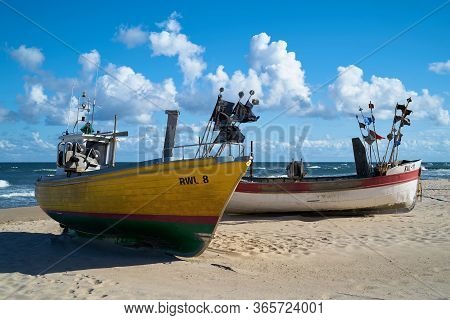 Rewal, Poland - September 02, 2019: Fishing Boats On The Beach Of The Polish Baltic Sea Coast Near R
