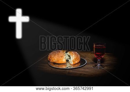 Cross Shining On Holy Communion Bread And Wine On Black