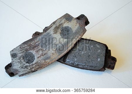 Pair Of Worn Out Ruined Disc Brake Pads