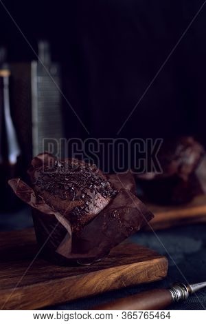 Chocolate Muffin On Dark Background Moody And Calm