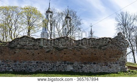 Ludza Medieval Castle Ruins On A Hill Between Big Ludza Lake And Small Ludza Lake And The Roman Cath