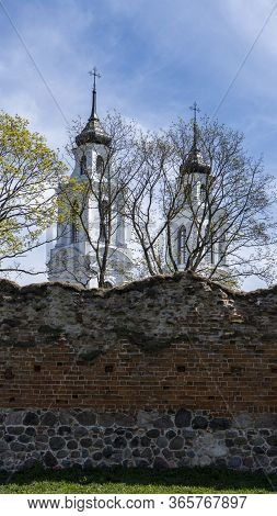 Ludza Medieval Castle Ruins On A Hill Between Big Ludza Lake And Small Ludza Lake And The Roman Cath