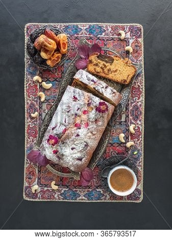 Honey And Date Cake On A Black Background. Top View.