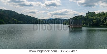 Nova Bystrica Water Reservoir With Hills Around In Slovakia During Nice Summer Day With Blue Sky And