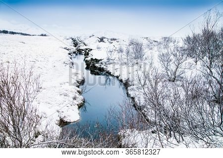 Beautiful view on Silfra rift during winter, the place where Eurasian and the American tectonic plate are divided in Thingvellir National Park, Iceland. 