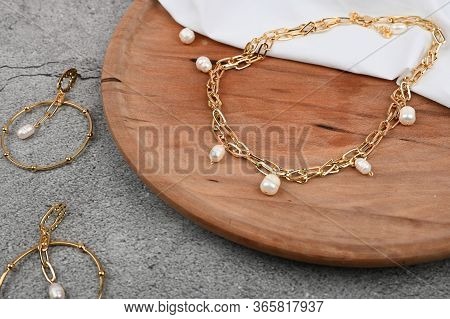 Gold Jewelry For Women On Wooden Background