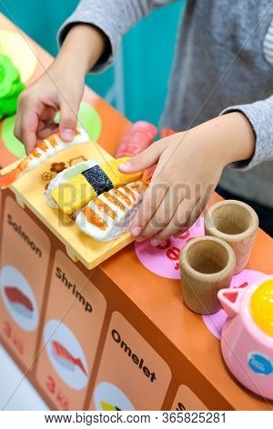 Child, Kid Role Playing Toy Sushi Chef In Toy Sushi Bar At Indoor Amusement Park For Kid. Play And L