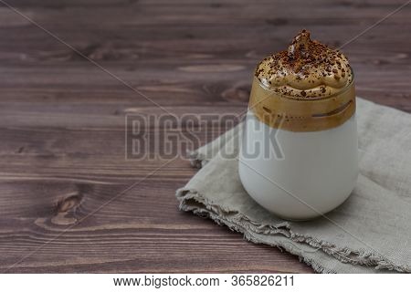 Dalgona Coffee, A Trendy Fluffy Creamy Whipped Coffee On A Wooden Background With Copy Space. Rustic