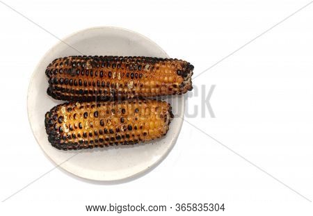 Top View Of Roasted Corn Or Maize In A Plate Isolated On White Background With Copy Space
