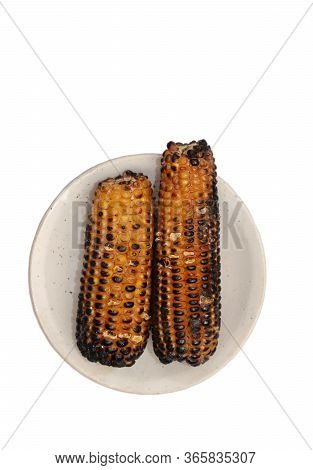 Top View Of Roasted Corn Or Maize In A Plate Isolated On White Background In Vertical Orientation