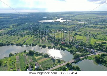 A Lake Glowing In The Sun And Curls Like A Snake