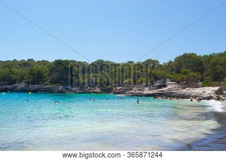 Little Beach With Turquoise Sea And Pinewoods Around -  Beautiful Spanish Island