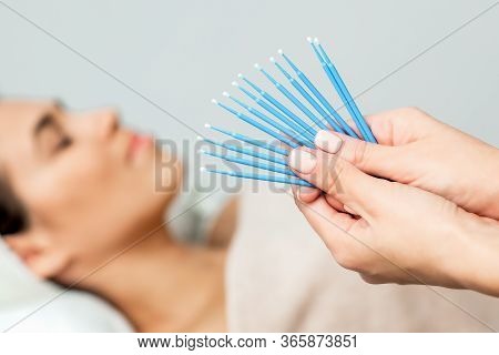 Eyelash Extension Disposable Microbrushes, Eyelash Cotton Swabs In Hands On Background Of Patient, C