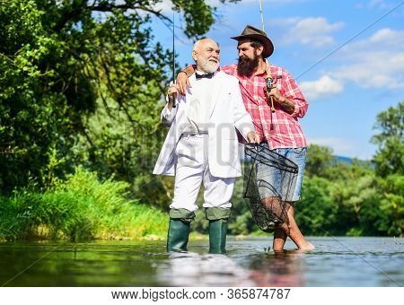 He Is Ready For The Fishing. Retired Father And Mature Son With Beard. Friends Men With Fishing Rod 