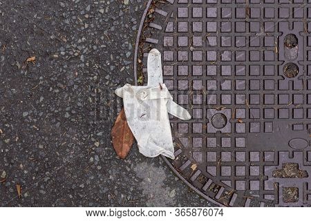 Waste Disposable Gloves On Graund, Top View, Asphalt, Used Ppe, New Problem After Quarantine