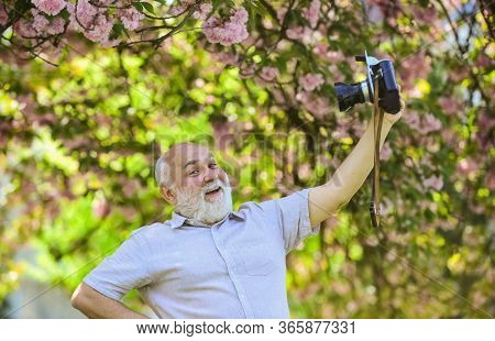 Self Portrait. Memories In Snap. Everyone Photogenic. Senior Man Taking Selfie Photo Vintage Camera.