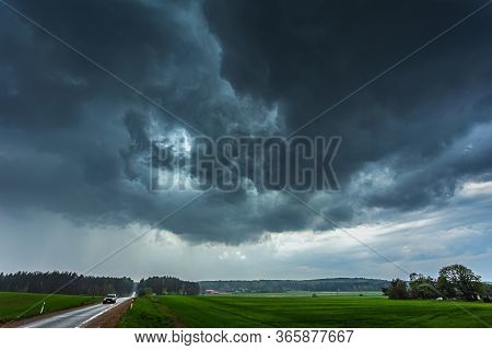 Storm Clouds With Shelf Cloud Base And Intense Rain