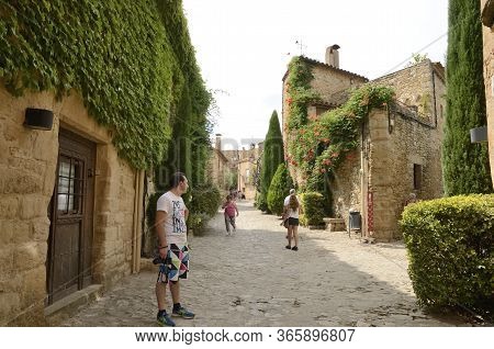 Peratallada, Spain - July 25, 2017: People At Cobbled Street Of The Medieval Village Of Peratallada,