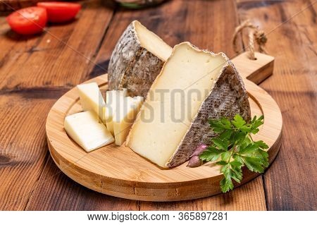 Pieces Of Cheese Tomme De Montagne Or Tomme De Savoie Made From Cow Milk In French Alps.