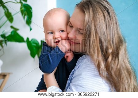 Happy Baby. Little Cutest Chubby Caucasian White Infant Child Looking And Smiling At Camera On Mothe