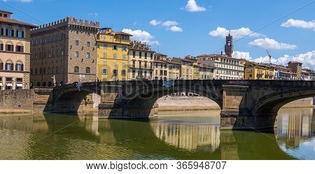Florence, Italy - August 16, 2019: The Ponte Di Santa Trinita Or Holy Trinity Bridge Over River Arno