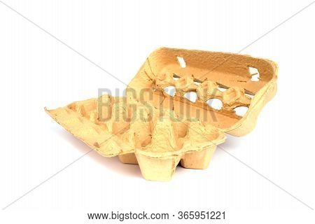 Empty Grass-based Egg Box Made From A Mixture Of Ryegrass, Hay And Recycled Paper Isolated On White 