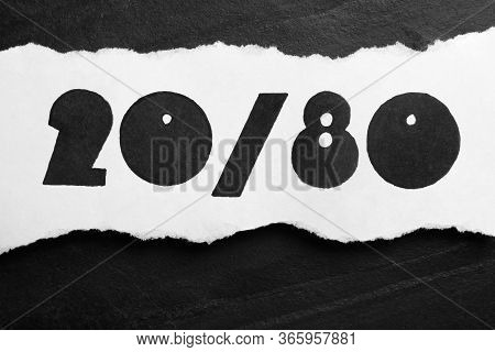 Sheet Of Paper With Numbers 20 And 80 On Black Slate Background, Top View. Pareto Principle Concept
