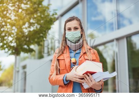 Student wearing mask during covid-19 cannot enter closed university building
