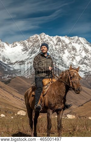 Horseback Riding The Snowy Mountains Of Svanetia Region Of Georgia.