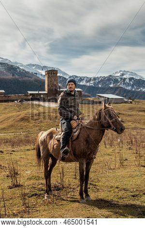 Horseback Riding The Snowy Mountains Of Svanetia Region Of Georgia.