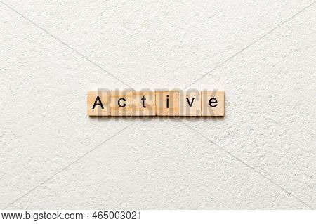 Active Word Written On Wood Block. Active Text On Table, Concept.