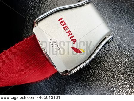 Madrid, Sp, July 2022: Detail Of The Buckle Of The Seat Belt With The Logo Of Iberia On An Empty Sea
