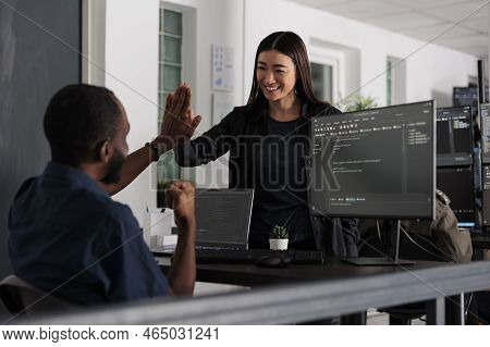Happy System Engineers Celebrating Successful Code Script Compiling, Doing Highfive Hand Gesture Aft
