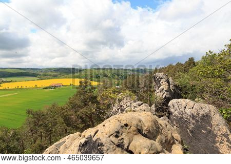 Panorama View Of Harz Mountains With Rapeseed Field Seen From Teufelsmauer, Germany