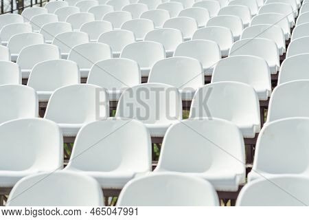 Seats Of Tribune On Sport Stadium. Concept Of Fans, Chairs For Audience, Cultural Environment Concep