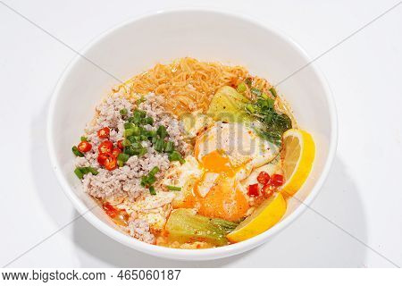 Asian Food, Minced Pork And Egg Noodles In A Cup On White Background.