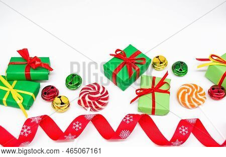 Happy Holidays: Gifts With Lollipops And Red, Green, Golden Bells. Red Ribbon On White Background, C