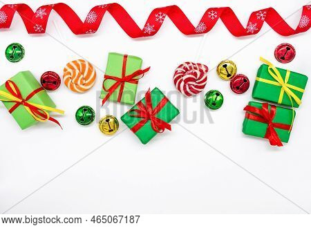 Happy Holidays: Gifts With Lollipops And Red, Green, Golden Bells. Red Ribbon On White Background, C