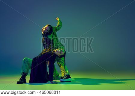 Two Dancers, Stylish Fashionable Dance Couple Dancing Contemporary Dance On Colorful Gradient Blue-g
