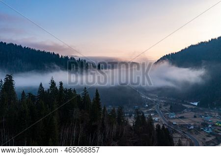 Panorama Of A Ukrainian Mountain Village, A View Of The Village Among The Clouds From Above.