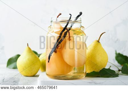 Canned Pear Compote With Vanillin. Pear Compote. Homemade Delicious Canned Pear Compote In Glass Jar
