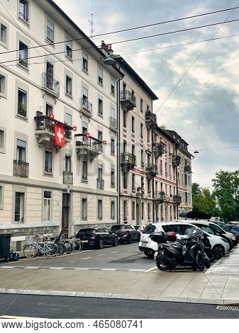 Geneva, Switzerland - September 15 2021: The Swiss National Red Flag With A White Cross Is Hanging O
