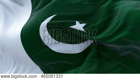 Close-up View Of Pakistan National Flag Waving. The Islamic Republic Of Pakistan Is A State Of South