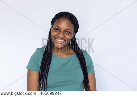 Smiling Woman Looking At Camera. Young Female Model In Turquoise T-shirt Standing With Friendly Expr