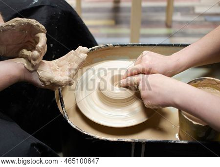 Man And Woman Sculpt With Clay. Clay Modeling Training On A Potters Wheel. Art, Creativity. Modeling